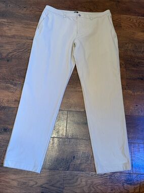 Lululemon ABC pants in 38W 32L in a light tan, cream khaki color.